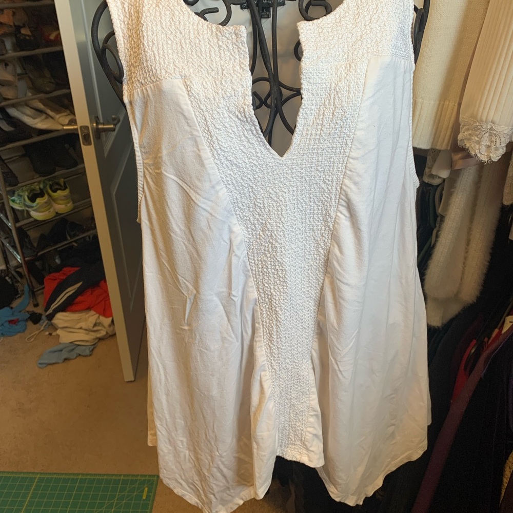 White asymmetrical sleeveless blouse